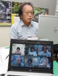 シンポジウムで奄美大島の魅力を語る常田守さん＝１０日、奄美市名瀬の南日本新聞奄美総局