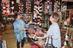 １０月末で閉店する「手づくり工房ふみ」。常連客と話す久保朋代さん（左）＝日置市東市来町養母