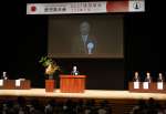 あいさつする日本建築士会連合会の古谷誠章会長＝２５日、鹿児島市山下町の宝山ホール