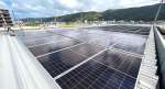 事業所の屋根に設置された太陽光発電設備（九電みらいエナジー提供）＝奄美市名瀬