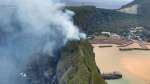 三島村硫黄島の山林火災現場＝１９日午後５時前（同村提供）
