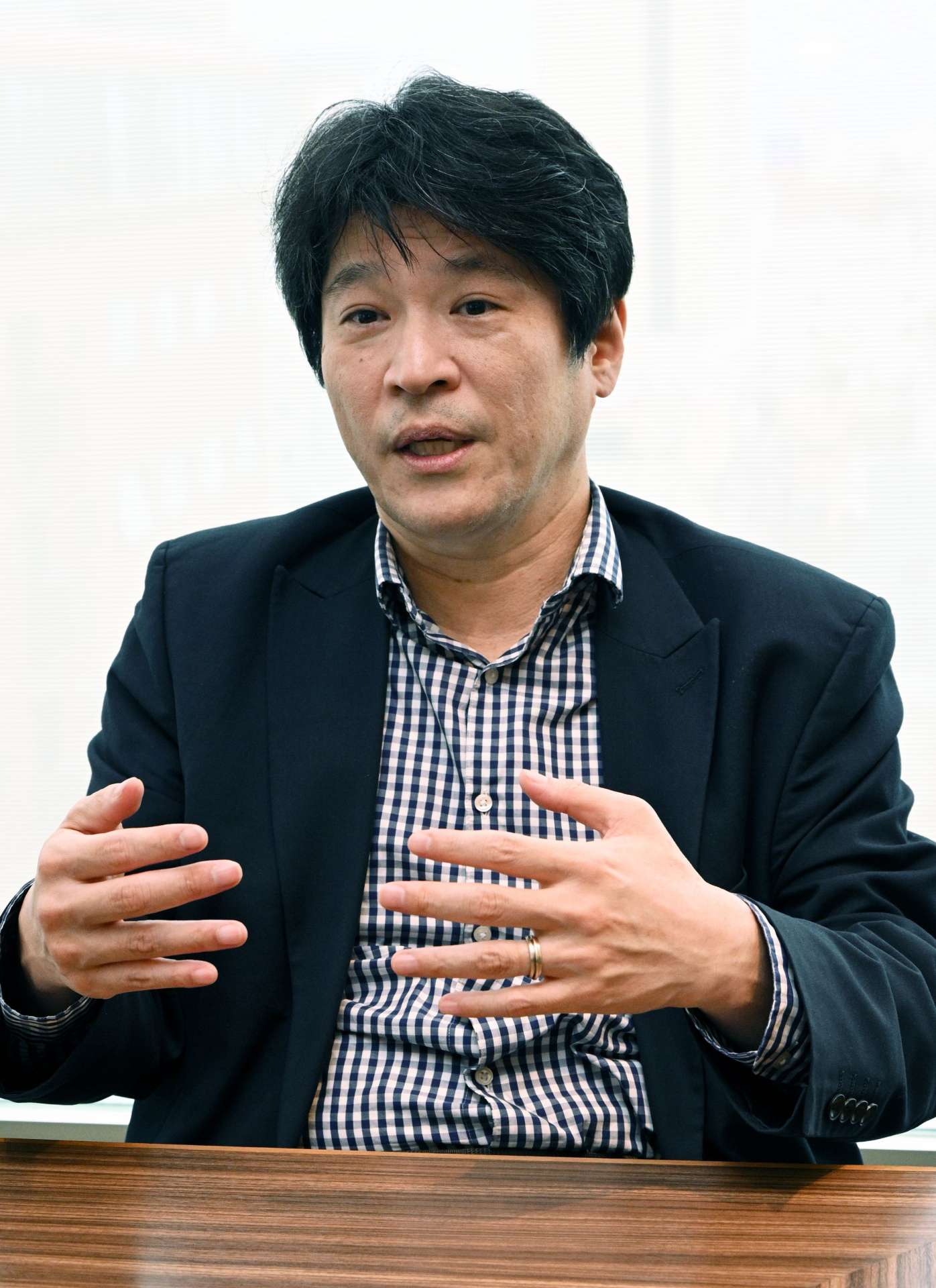 「事業者の悩みに合わせた提案が大事」と話す金融庁企画市場局の新発田龍史審議官＝１０日、鹿児島市山之口町のホテルグランセレッソ鹿児島