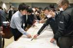 川内川改修の図面を確認しながら説明を受ける住民ら＝薩摩川内市の東郷公民館