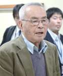 協議の場であいさつする水俣病被害市民の会の山下善寛代表＝９日午後１時半ごろ、熊本県水俣市