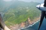 〈資料写真〉土砂崩れのような跡が見える、悪石島南側の山肌＝９日午後１時５分ごろ、十島村悪石島