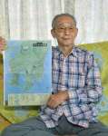「オリンピック作戦」の計画図を手にする中山重雄さん＝いちき串木野市大里