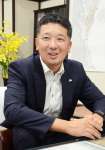 「地域の人との縁が地方勤務の醍醐味」と語る中西則文副市長＝鹿児島市役所