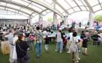 舞台発表でにぎわうイベント会場＝２７日、鹿児島市浜町のかんまちあ