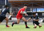 後半、鹿児島市消防局の畠山が中央にトライを決める＝県立サッカー・ラグビー場