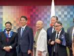ナウル共和国のナショナルデーに出席した三共建設の中島竜作社長（右端）＝大阪府の大阪・関西万博会場