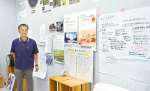 「まちなか記憶展」や市民活動の記録を展示し、見学者も多い都城市立図書館のプロジェクトスタジオと井上康志館長＝都城市中町